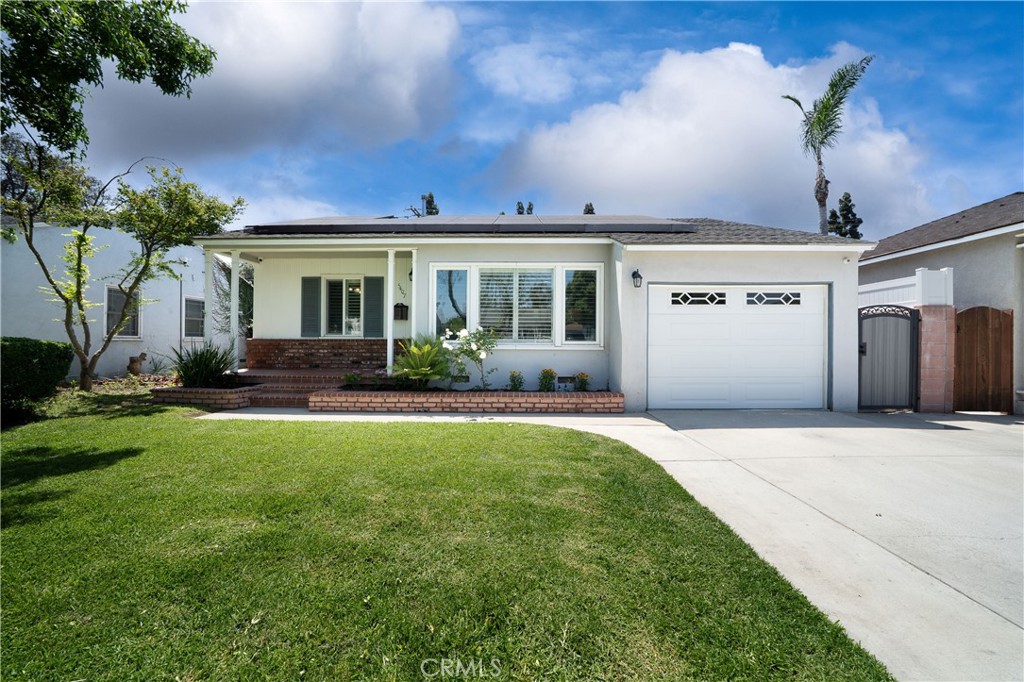 Beautifully upgraded and meticulously maintained, this turnkey Lakewood Mutuals home offers exceptional features inside and out, starting with an extended concrete driveway that accommodates two full-size trucks, brickwork accents on the front patio and flower beds, a sprinkler system, and a new water main line and irrigation system. Step inside to a spacious living room with recessed lighting, surround sound, and security camera/DVR prewiring to conveniently view home security camera system. The remodeled kitchen boasts granite countertops, upgraded decorative cabinets, stainless gas 5-burner range with vent hood, refrigerator and dishwasher (all included), tile backsplash, pantry storage, and copper plumbing. The hall bathroom includes a pedestal sink, tile flooring, Bluetooth speaker, color-changing lighting, and a real wood storage cabinet. The primary suite features a remodeled ensuite bathroom with stone flooring, granite vanity, skylight, and an elegant glass step-in shower featuring intricate tile work and upgraded fixtures. Also enjoy a walk-in closet and sliding shutters over the sliding glass doors leading directly to the private backyard. All bedrooms have ceiling fans, and dual-pane windows with plantation shutters offer both energy efficiency and style. Enjoy year-round comfort with central A/C and heating, laminate flooring throughout, and a 35-year composition shingle roof. The laundry area, located in the garage, includes new copper plumbing and gas dryer hookup. The attached garage also offers an automatic door, storage shelves, a high-pitch roof for extra bonus storage, and houses the security DVR system. The backyard is perfect for entertaining with a 10-ft high covered patio with recessed lighting and a ceiling fan, large grass area, privacy wall toppers, cinder block walls, trench drain along the concrete side yard, and a storage shed. Additional upgrades include a new 200-amp electrical panel, dual paned vinyl windows and plantation shutters throughout, laminate wood floors, Brink’s home security system with motion and entry sensors, six infrared HDMI security cameras with 30-day DVR recording, and SunRun solar panels on both sides of the home radically reducing your electricity bill. Enjoy all Lakewood has to offer with all their amazing parks, events, sports programs, nearby restaurants and shopping. A rare blend of comfort, convenience, smart upgrades and great location—this home has it all!