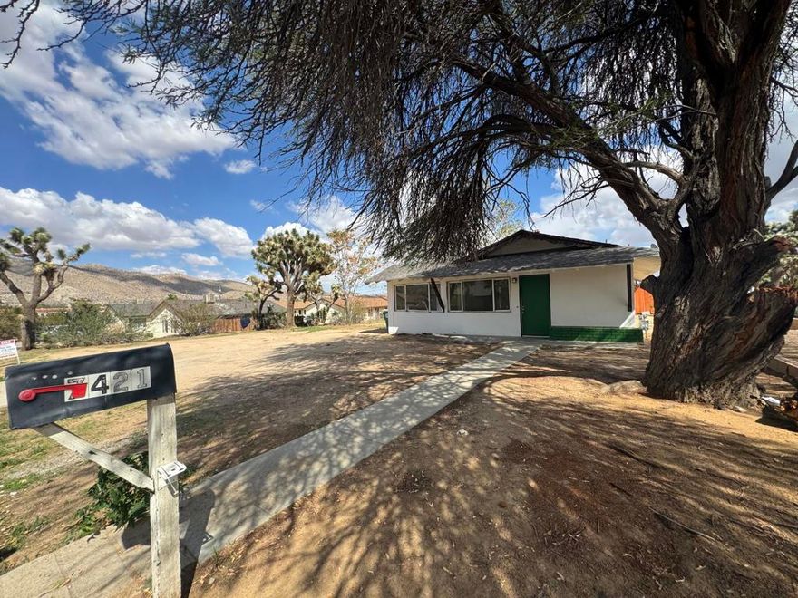 Great opportunity to own a charming 3-bedroom, 1-bath home on an approximately 19,000 SF lot. It is currently being updated with new tile, new carpet, new cabinets, new countertops, new shower, sinks, LED lights, and more. The open kitchen includes an island. This home is on a fee land and you own the lot, no HOA. Your imagination will run wild with the open and vast backyard, making it the perfect place to start a backyard project. This property is suitable as a short-term rental, investment property, vacation home, or first-time residence. Buyers may look into different financing options like FHA, VA, 0% down, or Seller May Carry. (Buyers MUST verify with the City the availability of a short-term rental permit if applicable). This home is located near town life, including shops, restaurants, stores, and special events like the Gubler Orchid festival. Additionally, it lies between the lush Palm Springs, Joshua Tree National Park, and neighboring cities. Come see this wonderful home TODAY!