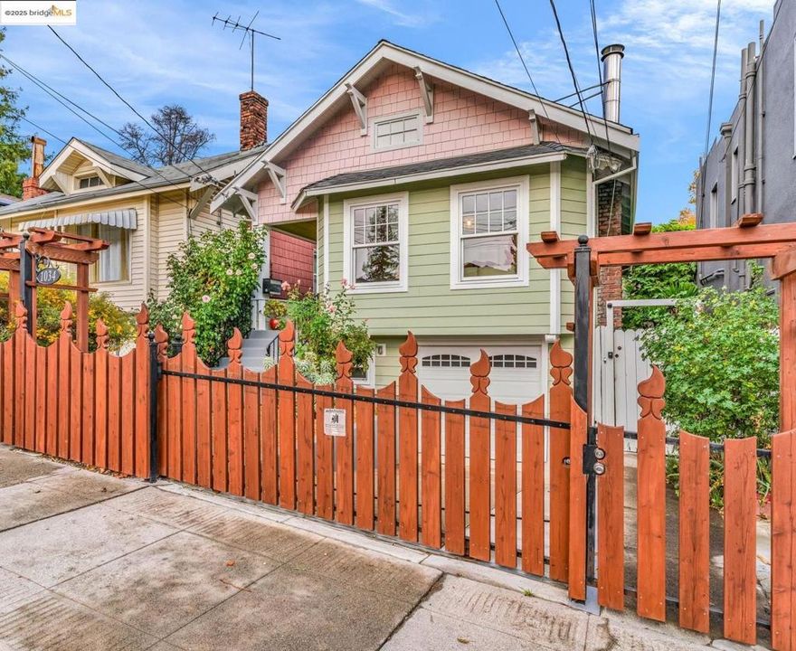 Charming Craftsman in Oakland’s vibrant Clinton neighborhood! This timeless 2+ Bedrooms / 2 bath home blends classic character with modern updates. Enjoy beautiful wood floors, a light-filled living room with decorative fireplace, and a formal dining room featuring box-beam ceilings and elegant wainscoting. A large kitchen boasts granite countertops, stainless steel appliances, and tiled floor. Stylish updated bathrooms feature subway tile and clawfoot tubs. The main level has 2 bedrooms and 1 bath.  The finished downstairs space, complete with a separate entrance bath and kitchen, is ideal for artists, makers, home office, guests, multigenerational living—the possibilities are endless. Tons of bonus / storage space! Outside, enjoy a backyard with large raised garden beds and space to entertain.  Right next door to Café Xochi with great coffee and food and close to Champa Garden, Lake Merritt, and the Grand Lake and Lakeshore districts, with easy access to transit and freeways. Work at home or at the cafe! Super convenient. Attached garage plus gated off-street parking. Roof done (2016), Hardi board siding, 100 amp electrical, laundry room w washer/dryer, sewer compliant ++ 83 Walkscore! A true neighborhood gem with heart and character~