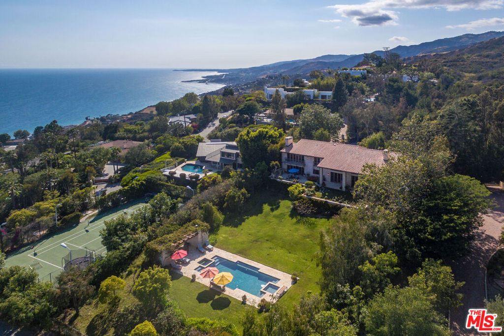 Perched atop the coveted upper section of Big Rock Drive, this exceptional estate parcel offers sweeping, unobstructed ocean and city views stretching from Palos Verdes to Catalina and beyond. Located just minutes from Pacific Coast Highway and the heart of Santa Monica, this Palisades burn-out property presents an incredible opportunity to rebuild a stunning coastal retreat. The expansive lot previously featured a magnificent 6,079 sq ft two-story Mediterranean villa complete with pool, set amidst serene privacy and commanding vistas. Full Army Corps of Engineers Phase 1 and Phase 2 debris removal has been completed and signed off, clearing the path for development. Whether you're envisioning a legacy estate or a bespoke modern masterpiece, this premier location combines convenience, prestige, and breathtaking natural beauty. Motivated sellers present a compelling chance to create something truly extraordinary in one of Malibu's most sought-after neighborhoods.