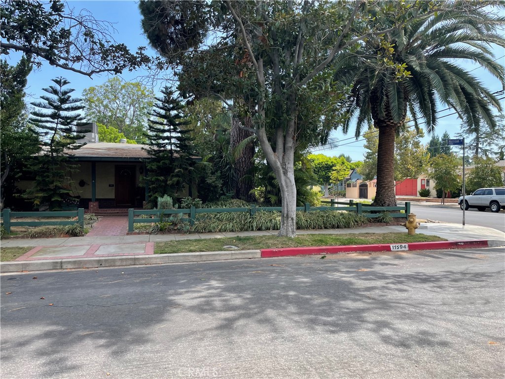 Welcome to 11594 Morrison, off-market for over 30 years, and an exceptional prospect for building a wonderful life in the heart of Valley Village! With some TLC and your discerning vision, create your own unique corner of the Southern California Dream! Located a block from the coveted BLUE RIBBON COLFAX CHARTER SCHOOL (along with Walter Reed and North Hollywood High for upper grades), you’ve got 3 roomy bedrooms and 2 baths over 2450sf, plus a bonus space with 1 bed/1 bath that can serve as office, in-law suite, or even ADU for rental income. Marvel at the amazing greenery throughout your expansive, over-quarter-acre corner lot, including a landmark majestic Ponderosa pine that can be admired from miles around. While there’s plenty of space in the generous backyard for celebrating with family and friends around the pool with its standalone bar and covered patio to entertain in style, you’ve also got your own set-aside meditation garden for contemplation and serenity in the quiet times.
With a 79 Walkability score, and the famed NOHO Arts district just minutes away, you’re also close to Universal Studios, Warners, Disney, NBC and quick freeway access to all the SoCal attractions that make this major metropolis so marvelous! All while your very own oasis of peace awaits. Don’t miss this chance to put your distinctive stamp on this exclusive pride-of-ownership opportunity!