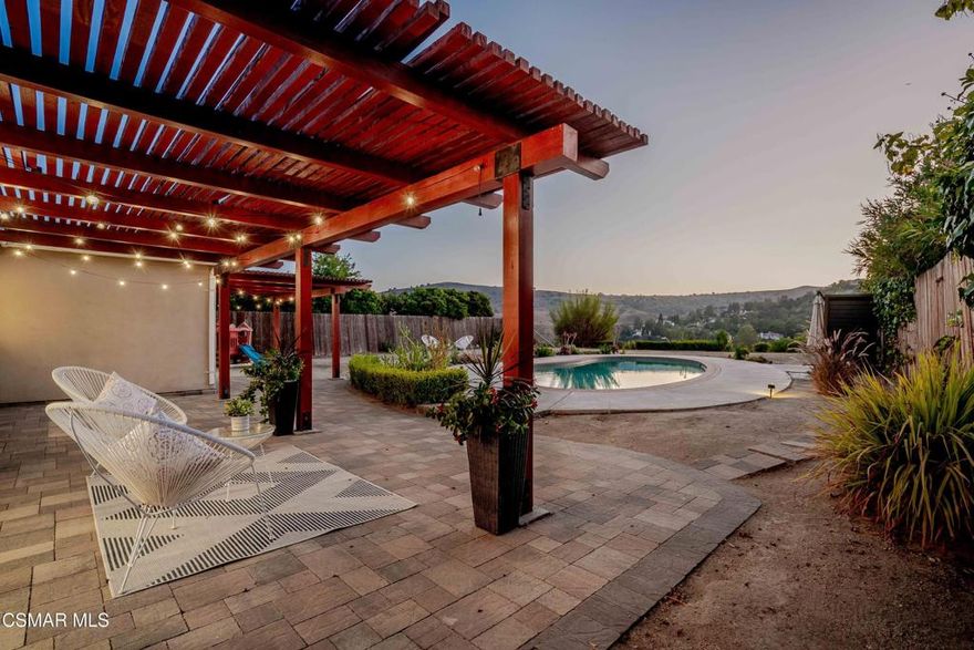 Welcome to this beautifully reimagined private, sun-drenched oasis, nestled in one of Calabasas' most sought-after neighborhoods. This sophisticated single-story home offers a bright and airy layout filled with natural light, where new wide-plank light oak hardwood floors stretch across open living spaces. The main gathering area features a sleek fireplace, stunning ''Empress Teal'' accent wall and floor-to-ceiling windows, and oversized sliding doors that invite the outside in, creating an inspiring atmosphere for relaxing or entertaining. A stylish dining space flows into a state-of-the-art kitchen complete with custom cabinetry, large center island, polished quartz countertops, high-end stainless appliances, and smart storage built for modern living. With four generously sized bedrooms with remodeled guest bath with new vanity, including a front facing primary bedroom and remodeled en suite bath. A versatile bonus room opens directly to the backyard, ideal for a home gym, creative studio, or private guest quarters. Outside, your personal paradise awaits. Cool off in the crystal-clear (recently converted) saltwater pool, unwind under a strikingly beautiful redwood cover, or host unforgettable evenings on the expansive patio. Panoramic views of the surrounding mountains provide a stunning daily backdrop, giving you the feeling of living in European hillsides. The home also boasts a premium NEM2 solar system, ready to keep energy bills nearly nonexistent. Recent updates include a brand-new roof (2023 w/10 yr warranty), upgraded 200-amp electrical panel with extra circuit, EV charger, new hardwood floors including leveling of the floors, installed recessed lighting throughout, new HVAC ductwork, new drip system, new linen closet in hallway, 2 guest rooms with California Closet organizers and storage, new closet doors in 1 guest room to triple rack. Ideally located just minutes from acclaimed Las Virgenes schools, hiking trails, boutique shopping, fabulous restaurants, convenience of the 101 freeway, and the legendary beaches of Malibu, this turnkey property delivers the ultimate Calabasas lifestyle. Elegant, efficient, and effortlessly connected to everything that matters.