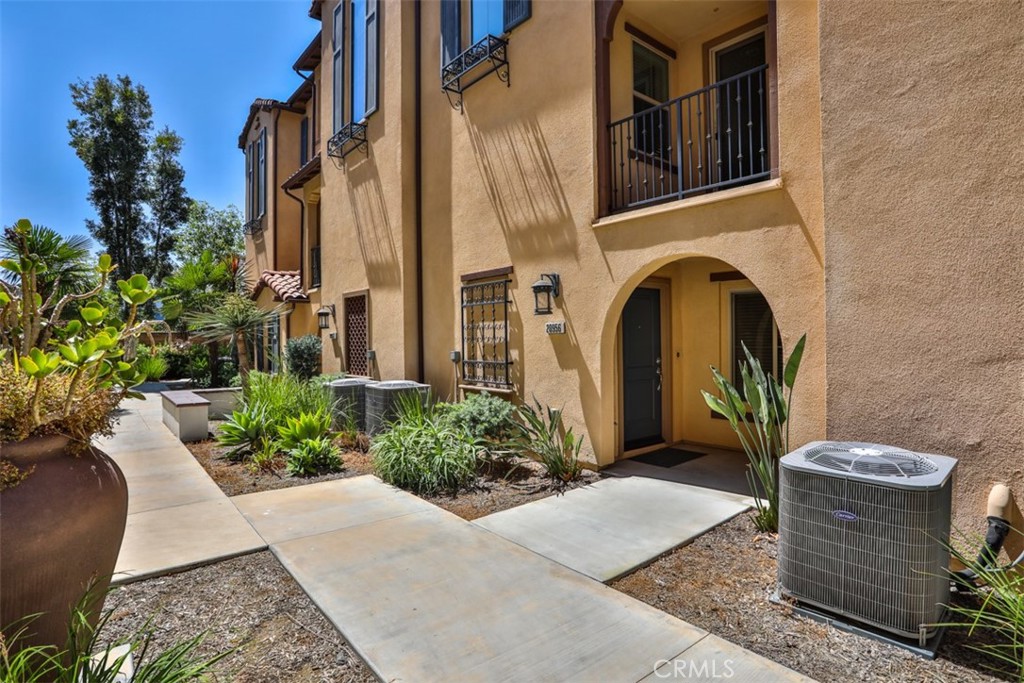 Welcome to 20956 Cornerstone Dr, Walnut – a beautifully maintained townhome nestled in a highly desirable community in the heart of Walnut. This spacious multi-level residence offers 3 bedrooms, 3.5 bathrooms, and an attached 2-car garage, designed with comfort and functionality in mind. The open-concept living area is filled with natural light and features high ceilings and direct access to a private balcony—ideal for entertaining or relaxing. The gourmet kitchen boasts granite countertops, stainless steel appliances, ample cabinet space, and an island counter making meal preps an ease. 3rd level includes 2 generously sized primary suites with walk-in closet and a spa-like ensuite with dual sinks and shower. 1st level includes an additional bedroom and bathroom perfect for guests or multi-generational living. Enjoy the convenience of in-unit laundry and central A/C & Heat. Community amenities include a playground, BBQ areas, well-maintained grounds, and plenty of additional guest parking. Located within the award-winning Walnut Valley Unified School District and close to parks, shopping centers, and freeways, this home combines comfort, style, and top-tier location.
