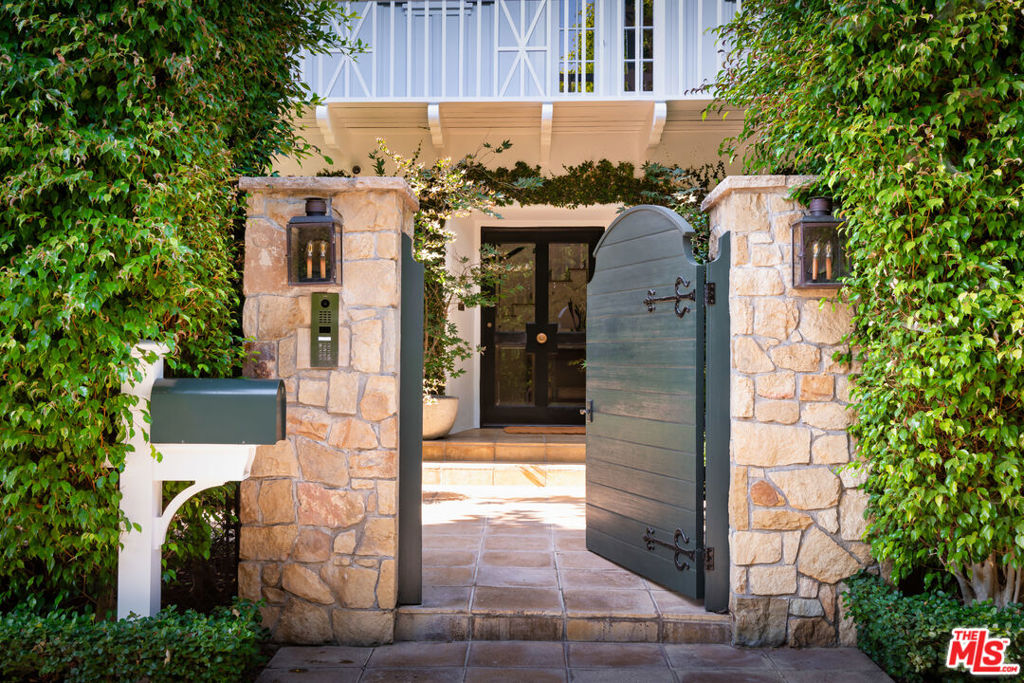 Extremely private at the end of the cul-de-sac on prestigious Perugia Way with extraordinary West facing views above the Bel Air Country Club. This 1932 Monterey Colonial has been remodeled with care to modernize and update while retaining the charm of a different era. Location, seclusion, views and old-world architecture that remains true to the past. A rare find.