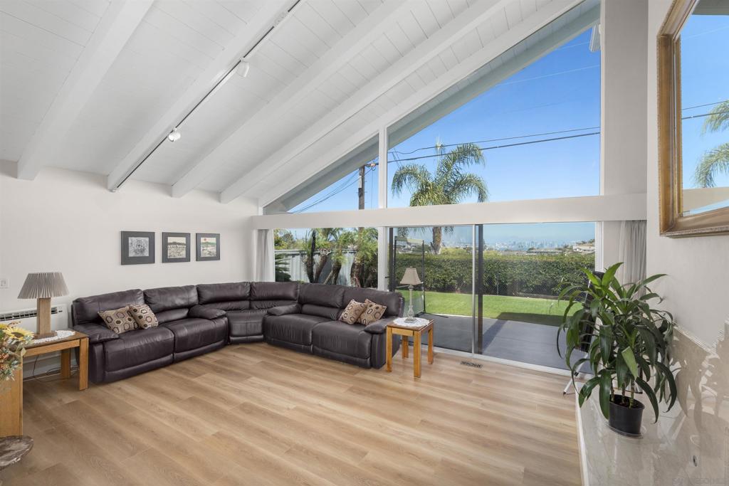 Welcome to 1151 Catalina Blvd, a stunning home in Point Loma with breathtaking views of San Diego Bay, the downtown skyline, and mountains beyond. Perfectly located minutes from top attractions, this 5-bed, 4-bath residence offers elegance, comfort, and energy efficiency with a fully owned solar system. A beautifully paved circular driveway leads to a serene atrium with floor-to-ceiling windows. Inside, dual primary suites provide luxury, with the upper-level retreat featuring vaulted ceilings, a private balcony, and a spa-like ensuite with dual vanities, a walk-in closet, and three extra closets. Designed for function and style, the kitchen boasts granite countertops, dual ovens, European-style cabinetry, and high-end appliances. The family and formal living rooms each showcase custom marble fireplaces, enhancing warmth and sophistication. Indoor-outdoor living shines, as two main areas open to a sprawling backyard with panoramic Bay, Harbor, and mountain views—perfect for entertaining or relaxing. This extraordinary home won’t last long—schedule your tour today!