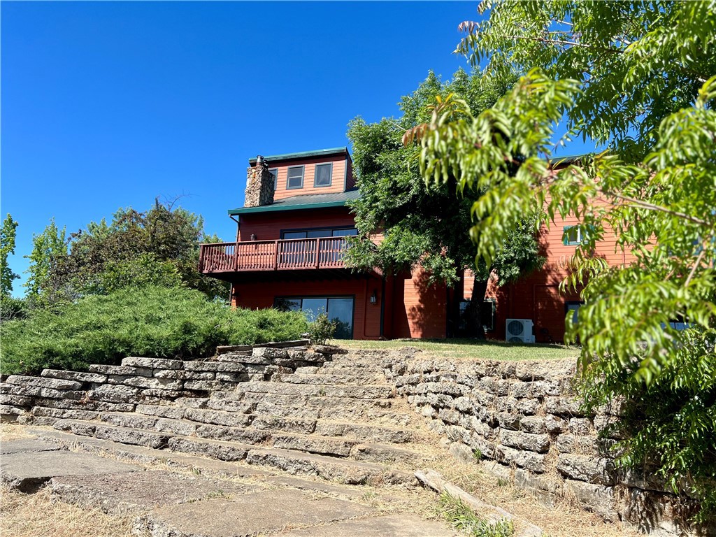 Seller financing available below current national average interest rate with acceptable offer for this beautiful nearly 4,000 sq ft home that has so much to offer including income potential. Located on use able 3 acres, perfect for mini ranch, out of city limits, but conveniently close to town with end of a cul-de-sac privacy. The approx 1700 sq ft main level is an entertainer's dream, featuring a remodeled kitchen with an island flowing into a living room, cathedral ceilings, and a floor-to-ceiling fireplace. An oversized slider opens to a deck, offering beautiful view of Mt. Konocti. This level also includes a large formal dining room, two guest bedrooms, and a beautifully remodeled guest bath with walk in shower. Primary Suite located upstairs with nearly 800 sq. ft. is a luxurious retreat with a jetted tub, walk in shower, fireplace and private balcony. Downstairs is approx 1250 sq ft. Offering incredible flexibility for income generation (long/short term rental) extended family or investment property. The large open room with wet bar(that could be converted to small kitchen), two bedrooms, one bath, separate entrance, and ample parking.There's also plenty of space for RV or boat parking too! For equestrian enthusiasts, the property is fully equipped with 3-stall barn, fencing, and arena area. Recent upgrades include a newly relined well with a new pump and pressure tank. With income potential, room for critters and toys, three fireplaces, multiple decks, a serene setting, this home offers much more than your average home.