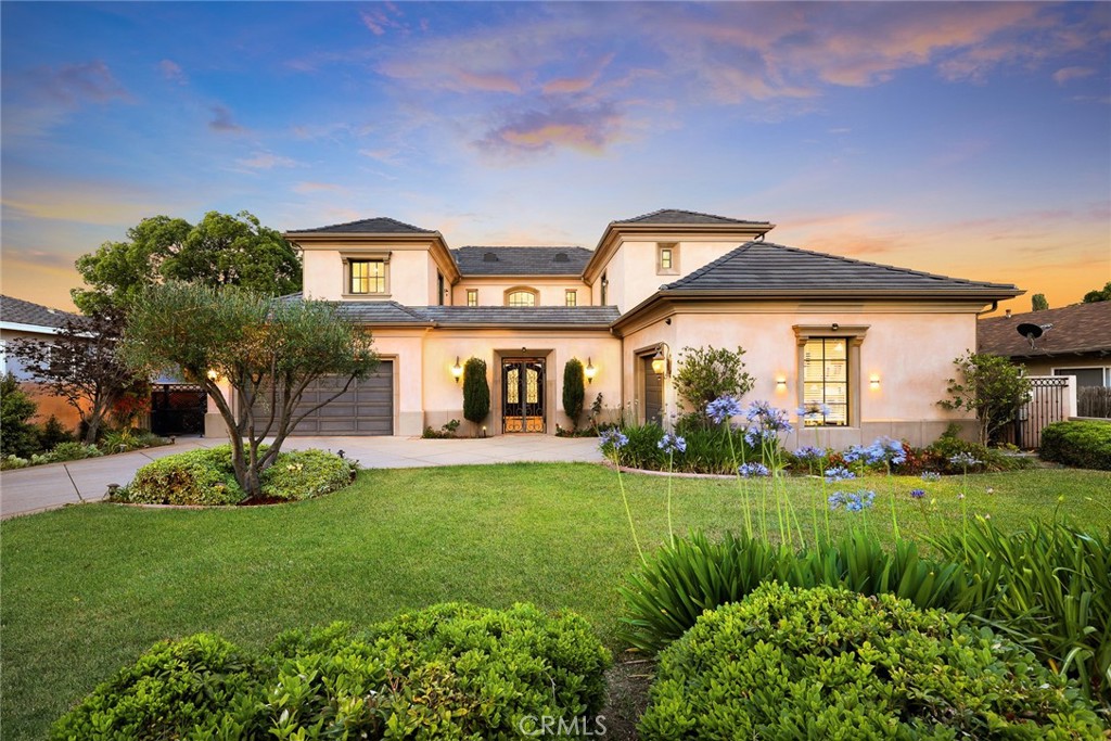 Welcome to this 2015 architectural estate by Robert Tong in prestigious Arcadia. The residence presents 6,722 square feet of refined living space on a generous 15,629 SqFt lot, offering a sophisticated lifestyle defined by exceptional quality and design.
Entering the elegant arch-deco front door to find an open floor plan distinguished by soaring ceilings,meticulous finishes throughout.
A grand foyer introduces the charming living room with a fireplace. A formal dining room and a refined library/office with its own restroom provides a quiet retreat for work or study.
The gourmet kitchen boasts a massive island, top brand stainless steel appliances, premium upgraded cabinetries, walk-in pantry, and an additional wok kitchen, a breakfast nook.
Flooded with natural light through French doors and well-allocated windows, the family room gracefully integrates the indoor space with the picturesque backyard oasis. A wet bar, and integrated wine storage.
A gracious en-suite bedroom, perfect for guests or multi-generational living. A pro home theater designed for entertainment. A separate laundry room and a powder room on the main level.
The upper level showcases a spacious loft, and the luxury primary suite with a gym room, a bathroom with a Jacuzzi tub, a shower stall, and a custom walk-in closet. Two en-suite bedrooms complete the upper level.
The professionally designed landscape backyard offers a decent-sized pool, spa, waterfall, BBQ area, and provides a great venue for family and friends to party. A convenient 3-car attached garage with electric car outlet, and lots of smart home features.
If you are seeking a masterpiece of contemporary real estate, it is here. This gated property is privileged with entrance to Arcadia's top-tier schools, enjoying a rare opportunity to own a legacy home in one of Southern California's most desirable locations.