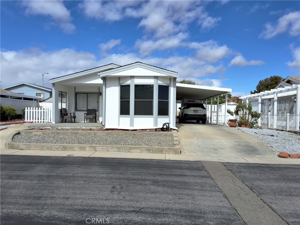 Welcome to this charming super clean comfortable Mobile Home, recently remodeled and ready for your buyers to move in!  This home features two bedroom, two bathroom, new vinyl flooring throughout the home, new bathroom cabinets with all quartz counter tops.  The Stylish Kitchen features an island, modern new cabinets, and pendant lighting.  Enjoy the bright, open feel with large windows bringing in natural light.