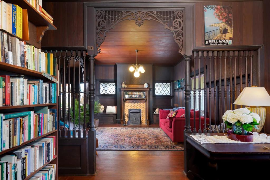 This beauty is filled with ageless, tightly fitted tongue-and-groove Douglas fir doorways, ancient redwood planking, vintage fixtures, and the grand centerpiece: panoramic ocean views from the iconic cupola, which has inspired countless individuals since its inception. The walls say, "It is better to light a candle than to curse the darkness." Climb the stairs to see for yourself. Long before our modern era, this home flaunts a distinguished history of residents who made their mark in local, regional and national culture and arts. This grand beauty is ready for its next chapter, flaunting great bones, a historic designation, legal duplex status, classic Craftsman wrap-around porches, and endless possibilities. The upstairs is full of vintage built-ins, long-lived fixtures, fathomless books, and ornate carvings still holding the memories of family, friends, celebrations, and laughter, while the first-floor rooms are skillfully arranged, like origami, ready to transform into a swan, a lotus flower, or a real-life crane, floating in the ocean and lake waters seen from the multitude of windows on every level. While the salty air and ocean elements can be harsh on the peeling paint so near to the sea, don't worry, this Majesty's story is not over; it is just a new beginning.