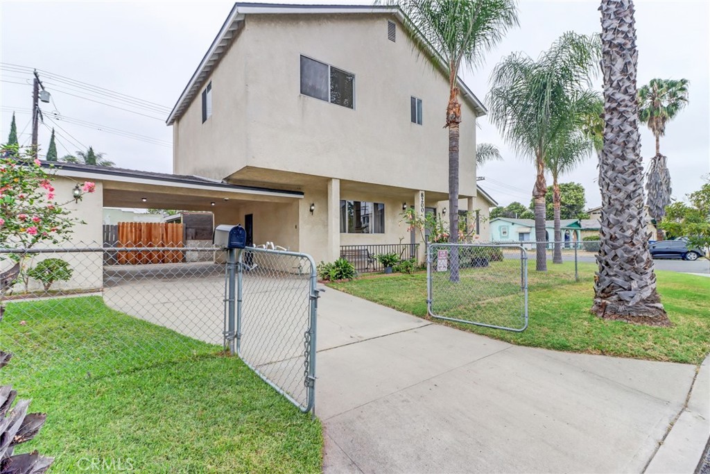First time on the market in over 40 years, this home has been lovingly cared for by one family. Welcome home to 8200 Priscilla St - a spacious two story home, NO HOA, competitively priced for this square footage home for the new buyer. With a rare open-concept kitchen and an incredibly flexible layout, the options are plenty. Step inside to find a generously sized living room and a layout that gives you plenty of options. The open kitchen flows into a space that can function beautifully as a dining area, family room, or casual hangout zone—whatever fits your lifestyle. From the kitchen, you can look directly out to the fenced yard, making it easy to keep an eye on outdoor games or enjoy the view of your private green space. In a neighborhood where open-concept kitchens are hard to come by, this layout truly stands out. Downstairs, you'll find a full bathroom, a separate living room, and a bonus room— perfect as a home office (w/ separate entrance), creative studio, or optional 4th bedroom. Upstairs are three more generously sized bedrooms, including the primary with a large walk-in closet and an updated FULL bathroom with new shower/tub. All rooms enjoy plenty of natural light and privacy, and the home has been freshly painted throughout, with new lighting and plush carpeting upstairs for a clean, modern feel. Other highlights include a large separate laundry room with hookups in the carport, and interior storage space for bikes, tools, or recreational gear. The private driveway can accommodate three vehicles behind the gate, making parking easy and secure. Sitting on a well-manicured and low maintenance fenced corner lot, offers plenty of space for pets to roam and loved ones to gather. Located in the prestigious Blue Ribbon award winning Downey School District, known for its top-tier academic programs, it is the perfect place to put down roots and take advantage of this amazing opportunity.