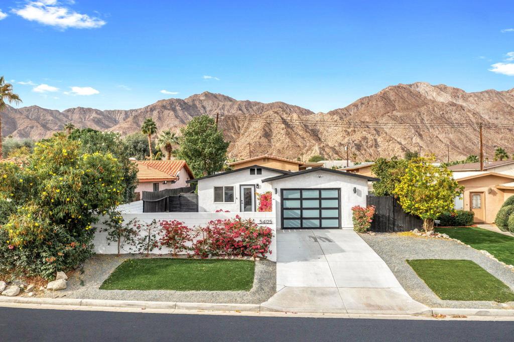 Nestled high in the desirable La Quinta Cove. This all-electric residence blends sustainable living with modern comfort and stunning mountain views. Designed with energy efficiency in mind, the property also offers the potential for solar installation--perfect for those seeking a greener footprint.Step outside into a resort-style home featuring a sparkling pool and spa, a putting green, cozy fire pit, and a lush lawn--ideal for hosting or relaxing under the stars. Inside, the open-concept floor plan is equally impressive with spacious living and dining areas, ideal for entertaining with a seamless indoor-outdoor flow.Surrounded by scenic hiking and biking trails, including Bear Creek and the Cove to Lake Trailhead, this home is perfect for nature lovers and adventure seekers. Located minutes from world-class golf courses, restaurants, art galleries, and Old Town La Quinta, this home offers the best of desert living. Whether you're looking for a full-time residence, vacation getaway, or investment property, this home checks every box.