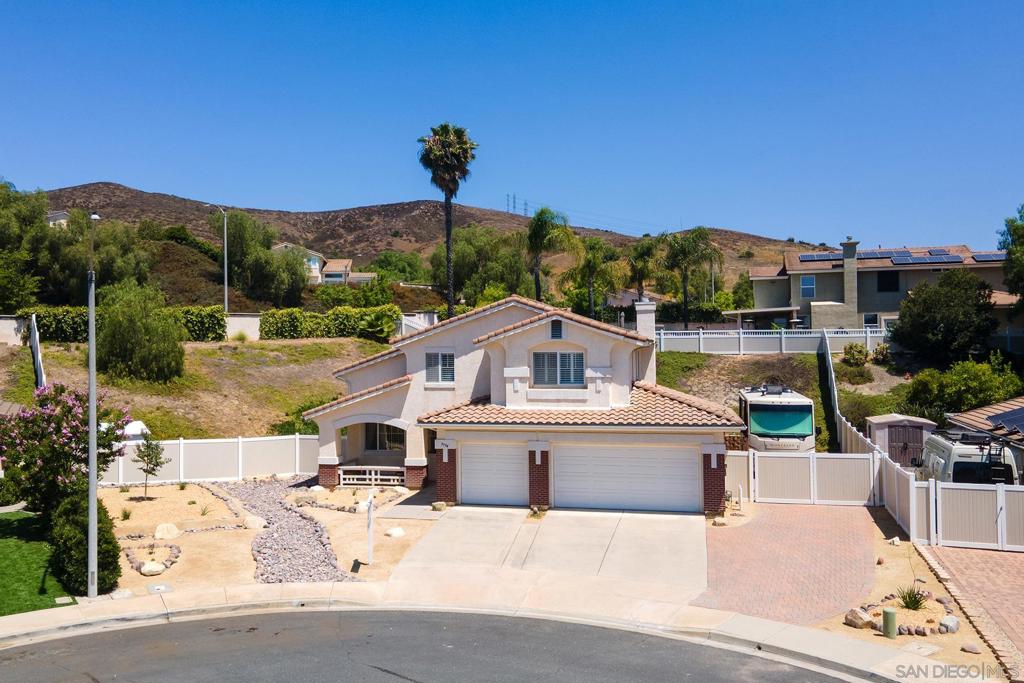 LOCATION, LOCATION, LOCATION!!!! Experience the Santee Lifestyle in this wonderful Cul-de-sac Home in a serene neighborhood. This spacious well-maintained home offers 2,236 SF of living space on 1/3 ac lot, 4 bedrooms, 2.5 bathrooms, covered patio, RV Parking, Paid in Full Solar System, EV Charger, large 3-car garage for ample storage/parking & freshly landscaped front yard. Top-rated schools in the Santee School District. Close proximity to Santee Lakes is ideal for fishing, camping, and outdoor adventures. See Supp Amazing scenic hiking trails within walking distance and stunning mountain and hillside views. Seller is offering all appliances including refrigerator, washer & dryer, patio furniture, Weber Grill, EV Charger, outdoor large shed and jacuzzi at no cost to the buyers. The 4th bedroom is used as an office currently, but it can be converted back to a bedroom with addition of a closet.