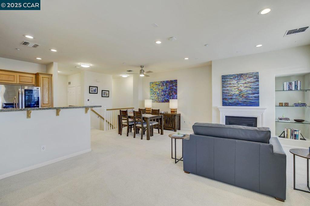 "Bundled service pricing available for buyers. Connect with the listing agent for details." This stunning 2-bed, 2.5-bath condo offers breathtaking skyline views of Wente Vineyards, blending modern luxury with comfort. Fully upgraded, it boasts cutting-edge technology, a new HVAC system, and DuPont premium carpet with deluxe padding. Solid wood doors, window shutters, and high-end appliances elevate the living experience. Enjoy resort-style amenities including a large pool, jacuzzi, clubhouse, meeting room, and elevators. Located within walking distance to shops and restaurants, with quick access to the Dublin BART station and major highways 580, 680 & 84 to make your commute effortless. This is the perfect blend of convenience and luxury living.