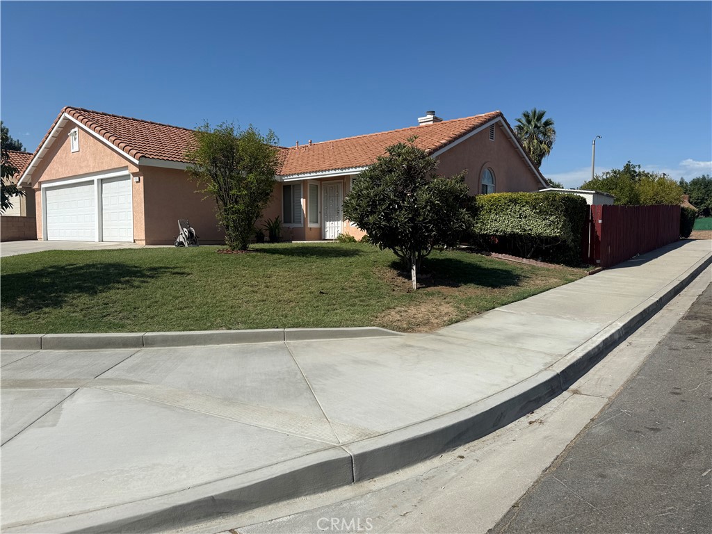 Nested in Rialto's most desirable neighborhoods in the cul-de-sac, this well maintained single story home featured 1,574 sf of living space, huge lot size of 8,366 sf, a 3 car garage, High ceiling in living room as you entered,4 bedrooms and 2 full baths. Primary suite with sliding glass door to backyard. Formal Living room and family room with dual fireplace. Newly painted inside and outside, just installed new water heater, Gas ranged/oven installed 9 month ago. Huge backyard with plenty of long plans tropical fruit trees and a side by side wood patio. Ideally and conveniently located near schools, parks, shopping, dining options, and the freeway. House is move in ready