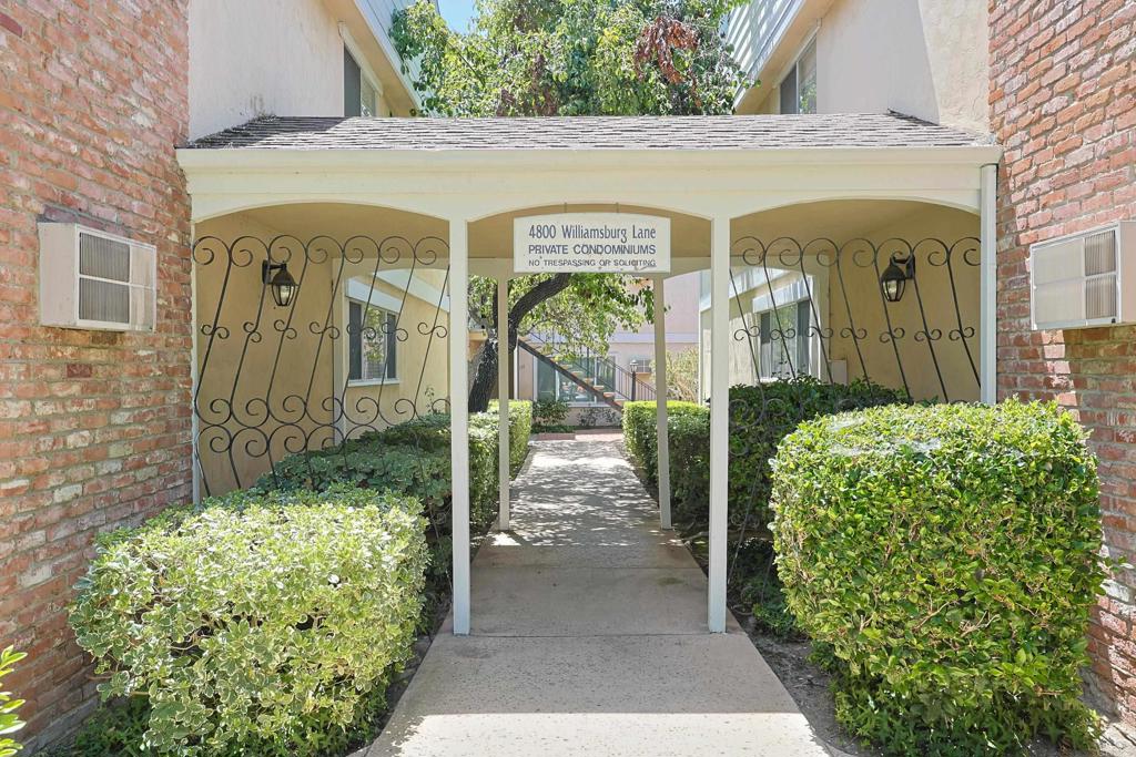 Welcome to this beautifully updated 2-bedroom, 2-bathroom ground-level condo in the charming Williamsburg Ln community. Featuring remodeled bathrooms, fresh paint, and laminate flooring. The bright kitchen boasts white cabinets, quartz countertops, and stainless steel appliances, while the dining area opens to a private balcony perfect for morning coffee or evening relaxation. Enjoy the peaceful ambiance of the French-inspired architecture, complemented by community amenities such as a pool and convenient laundry rooms. This unit includes a 1-car garage plus an additional open parking space. Ideally located near freeway access, shopping, dining, and just a short drive to downtown San Diego, naval bases, and local attractions.