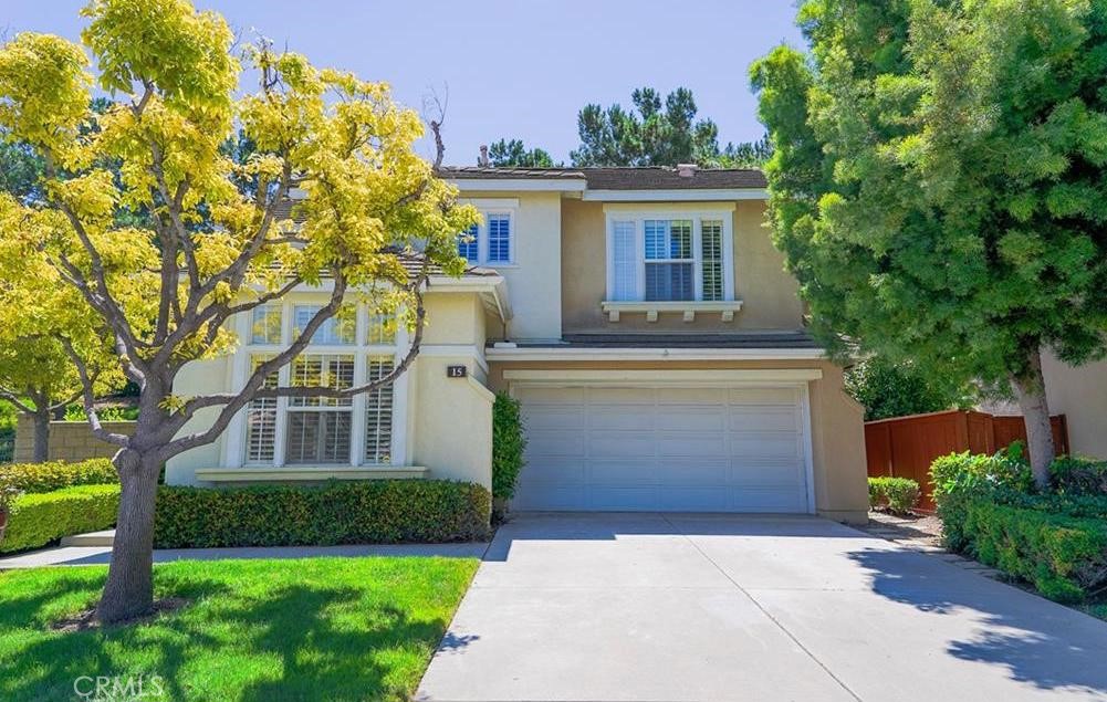 Ideally located on a premium pie-shaped corner lot at the end of a cul-de-sac, this beautiful home offers the best of Aliso Viejo living. Just minutes from Town Center, top-rated schools, parks, restaurants, and entertainment, this home is perfect for those who value comfort, style, and convenience.
Step inside to discover upgrades throughout, including a newer kitchen with newer appliances, abundant cabinetry, recessed lighting, and a walk-in pantry. The open living area features laminate wood flooring, plantation shutters, and a custom stacked-stone fireplace that adds warmth and charm.
The desirable main-floor bedroom with an adjacent full bath offers the flexibility of a guest room, home office, or private retreat. Upstairs, the spacious primary suite boasts soaring ceilings, a cooling ceiling fan, a walk-in wardrobe, and a remodeled ensuite bath with dual vanities, updated lighting, and modern fixtures. A large permitted bonus room upstairs offers exceptional versatility, use it as a fourth bedroom (with closet), home gym, office, craft room, or playroom. An additional upstairs bedroom enjoys its own private bath, perfect for family or guests. The nicely sized backyard is perfect for entertaining with a cozy gas fire pit and Arizona flagstone patio with low-maintenance aluminum patio cover. It’s ideal for al fresco dining, summer gatherings, or simply relaxing in your private outdoor oasis. The front yard is HOA maintained and lushly landscaped for year round curb appeal.
Enjoy direct access to hiking and biking trails that lead all the way to the ocean just 15 minutes to the beach! Plus, enjoy fireworks on the 4th of July near Town Center, and quick access to the 73 Toll Road. This is Aliso Viejo living at its finest don’t miss your chance to call this property your home!