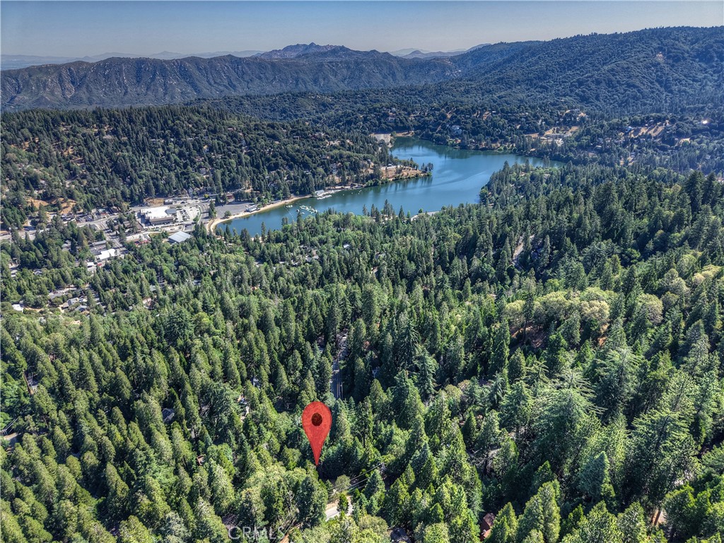 Build your Mountain Getaway in Crestline, California ~ This is a 6,130 square foot Lot ~ Located just minutes from Lake Gregory, hiking trails, and loads of outdoor recreation ~ Take in the Fresh Mountain Air, Year-Round Beauty, and experience a True Sense of Retreat ~ Bring your vision to life - your canvas in this San Bernardino Mountain Community awaits! No address has been assigned to this property.