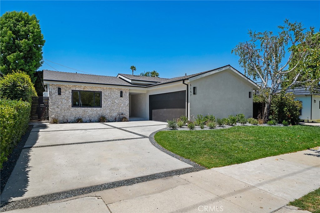 Luxurious reimagined single level home finished with top-tier quality and unique design elements, situated within the coveted Hesby Oaks school district surrounded by multi-million dollar homes. The expansive floor-plan offers 4 bedrooms and 3.5 bathrooms and the home is flooded with tons of natural light. A gourmet Chef's kitchen displaying porcelain countertops and a large center island with breakfast seating flows into the impressive wine display. The luxurious master suite offers a large walk-in closet and spa-like bathroom with double vanity space and walk-in shower. Private yard with ample grassy area, patio dining seating and built-in BBQ area. Additional amenities include surround sound throughout, security cameras, and easy access just minutes from Ventura Blvd and Encino's best schools, shops and restaurants.
