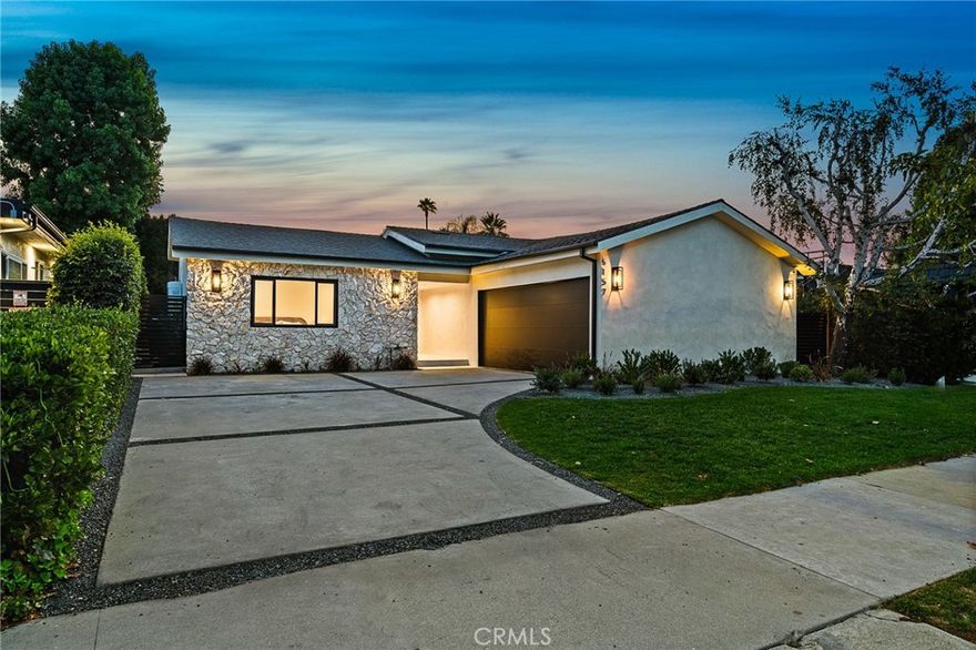 Luxurious reimagined single level home finished with top-tier quality and unique design elements, situated within the coveted Hesby Oaks school district surrounded by multi-million dollar homes. The expansive floor-plan offers 4 bedrooms and 3.5 bathrooms and the home is flooded with tons of natural light. A gourmet Chef's kitchen displaying porcelain countertops and a large center island with breakfast seating flows into the impressive wine display. The luxurious master suite offers a large walk-in closet and spa-like bathroom with double vanity space and walk-in shower. Private yard with ample grassy area, patio dining seating and built-in BBQ area. Additional amenities include surround sound throughout, security cameras, and easy access just minutes from Ventura Blvd and Encino's best schools, shops and restaurants.