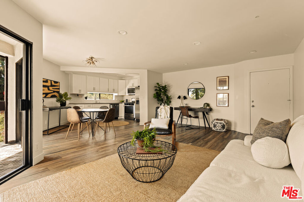 Welcome to the heart of West Hollywood. This top floor, corner unit penthouse offers privacy, style, and incredible natural light throughout. Large sliding doors open to an oversized private deck with peaceful views of lush, landscaped gardens perfect for relaxing or entertaining. Inside, you'll find a modern kitchen with quartz countertops, stainless steel appliances, fresh paint, LED recessed lighting, and an office nook. The layout is open and airy, with a linen closet and in-unit washer/dryer (uncommon for a 1 bedroom) for everyday ease. Set in a longstanding and well established gated community complete with a pool, spa and a gym. Just moments from the best of West Hollywood's dining, shopping, and night life, Unit 307 blends comfort, convenience, and location.