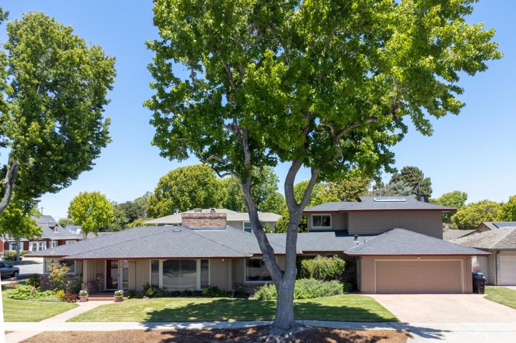 Discover the charm of South Salinas in the highly sought-after Maple Park neighborhood. This spacious home features 4 bedrooms and 3 baths on the main level, along with a versatile upstairs art studio that can easily function as an additional bedroom, office, or family room. Vaulted open-beam ceilings, skylights, and abundant natural light create a warm and welcoming ambiance. The lower level offers a generous kitchen and dining area, complemented by a bright living room with large windows and a beautiful fireplace. Thoughtfully designed for accessible living, the home includes a step-in tub, wheelchair ramp, and convenient single-level layout. Additionally, there is a basement and an attic for extra storage. Beautifully kept, & move-in ready. A rare find and full of potential. This is arguably one of the best neighborhoods in the town of Salinas; cozy, tucked away, and private.