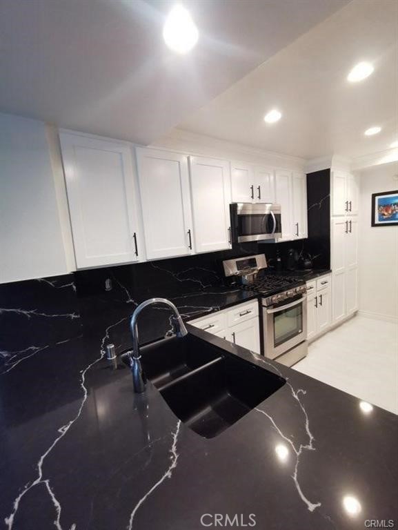 Photos coming soon. Fully furnished and recently remodeled throughout. South-facing home with green belt and tree views that offer a peaceful ambiance and gentle breezes. The home has a private balcony off the living room and bedroom. Enjoy your own private indoor laundry. The community boasts tennis courts, a community pool and spa, as well as a nice gym. Very close to 5-star restaurants, the beach, and Fashion Island. Available December 20, 2026.
