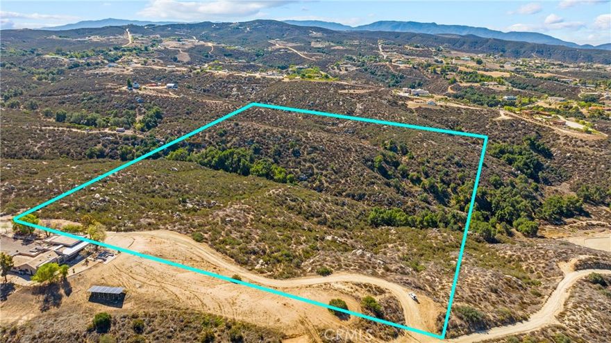 TWENTY ACRES in the hills near De Portola Road/ Glen Oaks community, wine country, Temecula. The northwest corner is marked where Calle Breve and Calle Azure meet. Forever views over the Temecula Valley and up toward the Santa Ana Mountains. There is approximately 669 feet of frontage on Calle Azure, where you can choose to bring in a driveway and switch back until you reach a naturally level area, perfect for a custom homesite, nestled in, but not obscuring yourself from those incredible vistas. Terrace your sprawling acreage down around magnificent boulder formations and down toward a natural waterway and stands of evergreen California Live Oaks. This gentle slope is ideal for grape vineyards, according to local farmers and winemakers. However, the Mediterranean climate is also suitable for a variety of other crops, such as olive or fruit orchards, nut trees, lavender, and other herbs, as well as flowers and other botanicals. YOU will grow better here, too, under unpolluted, gorgeous night skies, with clean air, and the space to really breathe. Surrounded by neighboring new and custom construction - but not too close - ensures an investment sure to repay its new steward in spirit and wholeness and value, for years to come.