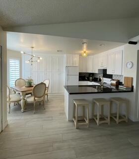 Welcome to this stylish and move in ready 2 bed/ 2 bath condo located in the desirable gated community of Royal Palms. This updated unit offers 925 square feet of comfortable living space with modern finishes and a functional layout.Inside, you'll find a brand new kitchen with generous cabinet space and a sleek breakfast bar--ideal for casual dining or entertaining. New flooring throughout the home adds a fresh, contemporary feel, while the in-unit stackable washer and dryer provide everyday convenience.The spacious primary suite features a large walk-in closet and an en-suite bathroom, offering a private retreat. A second bedroom and full bathroom complete the layout, making the space perfect for a variety of lifestyles.Additional features include carport parking, access to the community pool, clubhouse, and the peace of mind that comes with living in a gated neighborhood.Royal Palms offers a tranquil yet convenient location in the heart of Palm Desert--just minutes from world-class shopping and dining on El Paseo, top golf courses, parks, and scenic hiking trails.$3200 a month. Can be a seasonal or annual lease.