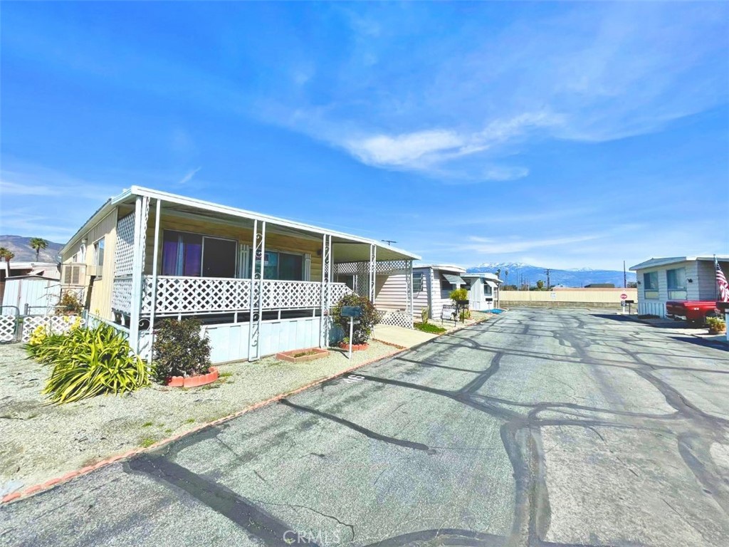 THIS IS YOURS! a 2-bedroom, 2-bath home in the desirable 55+ Valley Sunrise Mobile Home Community. Enjoy fresh paint, an open living area filled with natural light, and an immaculate kitchen with pantry. Stay comfortable year-round with a new HVAC system under warranty for 8 more years. Washer/dryer hookups included. TWO storage sheds included! Seller is installing new laminate flooring as we speak! There is a free Lemon tree for buyer at closing. Home also comes with a Brinks security system (activation required). Community amenities include a pool and laundry room. Conveniently located near shopping centers.