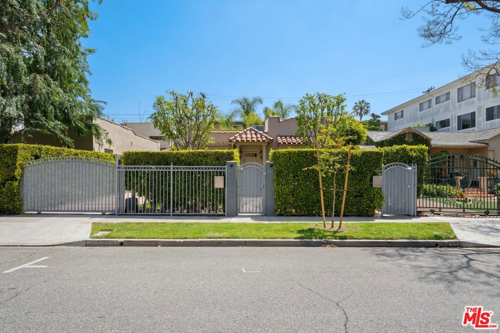 A quintessential Spanish home nestled in the heart of West Hollywood. Two bedrooms, two bathrooms, large living and dining rooms, a sizable kitchen with stainless steel appliances and laundry closet. Hardwood floors throughout, immense natural light, carpeting in bedrooms, freshly painted, dimmable LED lighting, central heating and AC, charming windows, decorative fireplace, built-in shelving, walk-in closet, shower / tub combo in primary suite, ample storage, ample driveway parking, gated entry and automatic driveway gate. private yard spaces in front and off of primary suite. The property is situated in close proximity to world-renowned design, dining, fashion, accommodation, medical facilities, and a plethora of other amenities.