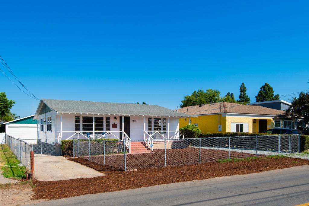 Nestled in the heart of Lemon Grove, this custom-built ranch style home offers the perfect blend of classic charm and modern comfort. Crafted with enduring, termite-resistant redwood, the residence boasts stunning hardwood floors in the living areas and bedrooms, while the kitchen and bathroom feature updated luxury vinyl plank (LVP) flooring. The kitchen and bathroom feature eclectic touches that infuse this home with character and vintage allure. Additional updates include fresh paint throughout and new ceiling fans. The kitchen is a culinary haven with newer appliances, including a gas range, and opens seamlessly to the living space. At the rear, a detached 2-car garage offers parking or the possibility of a workshop. Low maintenance landscaping in the expansive backyard creates potential for an ADU or a tranquil garden area. Also includes fully-owned solar and alarm system. Situated just under 10 miles from downtown, with easy freeway access and proximity to schools, parks, dining, and shopping, this home perfectly combines convenience with charm. Don't miss the chance to own a slice of Lemon Grove paradise - schedule your private tour today!