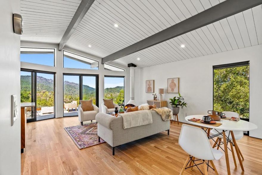 Perched on a serene hilltop in Quail Hollow, this home isn't just remodeled - it is reimagined as a sanctuary in the sky balancing mid-modern elegance with the raw beauty of the Santa Cruz mountains.  The open concept floor plan with vaulted ceilings and exposed beams highlights the breathtaking views with floor to ceiling windows while also providing natural light.  Outside, the landscaped patio area with a built in concrete gas fireplace provides a seamless indoor-outdoor flow. Ample parking, EV ready, RV parking with full hookups, and extensive retaining new retaining wall work in place. Inside, special features abound: wide plank white oak floors, quartz kitchen counters, walnut cabinets, Malm 34" Zircon freestanding fireplace, Saltless water softener and filtration, and trimless base walls. Come enjoy the view!