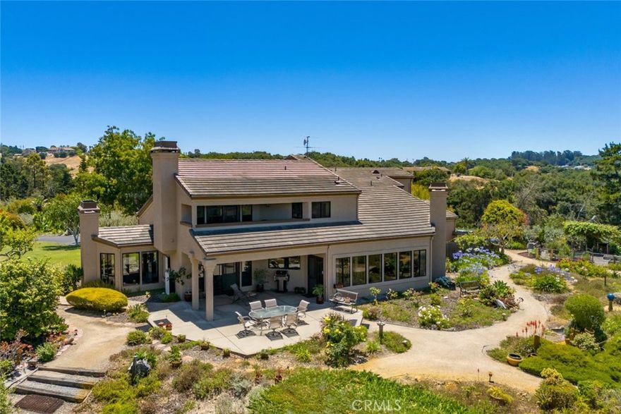 BOLD VIEWS. UNMATCHED QUALITY. YOUR CALIFORNIA DREAM ESTATE AWAITS!

Get ready to fall in love with this once-in-a-lifetime custom estate set on 8.66 jaw-dropping acres in the heart of wine country—where vineyards, orchards, and Pacific Ocean peeks all collide in a setting that is pure magic. On clear days, you can see all the way to Avila Beach, and when the sun starts to set, prepare yourself—this home delivers front-row seats to some of the most spectacular sunsets you’ll ever witness.

This isn’t just a home—it’s an experience.

Built with superior craftsmanship, designed to embrace bold views from every angle, and upgraded for modern luxury, this property brings a whole new level of excitement to daily living. The layout is open, flowing, and built for entertaining—starting with a show-stopping chef’s kitchen featuring Corian counters, massive prep island with sink, sleek stainless appliances, designer lighting, and custom cabinetry.

Enter a dramatic sunken family room where a floor-to-ceiling stone wall with inset windows and fireplace creates the ultimate hangout zone. Need more space? There’s a bright and elegant formal dining room that opens to a view-drenched patio, plus a second lounge area with another cozy fireplace.

Need flexible space? A main-level bedroom with ensuite (currently used as an office) and oversized 3-car garage deliver the versatility you're looking for.

Upstairs, the primary suite is an absolute showstopper—with a private balcony, spa-inspired bathroom (jetted tub, glass + tile shower, walk-in closet), and epic views that make waking up feel like a dream.

Outside, dive into a private in-ground pool and spa, surrounded by lush lawns, concrete patios, and nothing but vineyard-covered hills in every direction. Recent pool upgrades include a new pump, filter, heater, and cover.

Bonus perks: Owned solar + Tesla batteries. Two high-producing wells. 40' x 40' steel workshop/storage building with separate access road—ideal for hobbyists, entrepreneurs, or RV storage. New roof, updated windows, and fresh exterior paint—move-in ready with zero hassle. Fenced veggie garden + multiple outdoor zones for dining, games, and next-level relaxation.

This home has it all—views, privacy, designer finishes, space to grow, and unmatched energy. Whether you're looking to host epic gatherings, dive into vineyard country living, or just wake up to something extraordinary every day...

This is your moment. Book your showing. Live the dream.