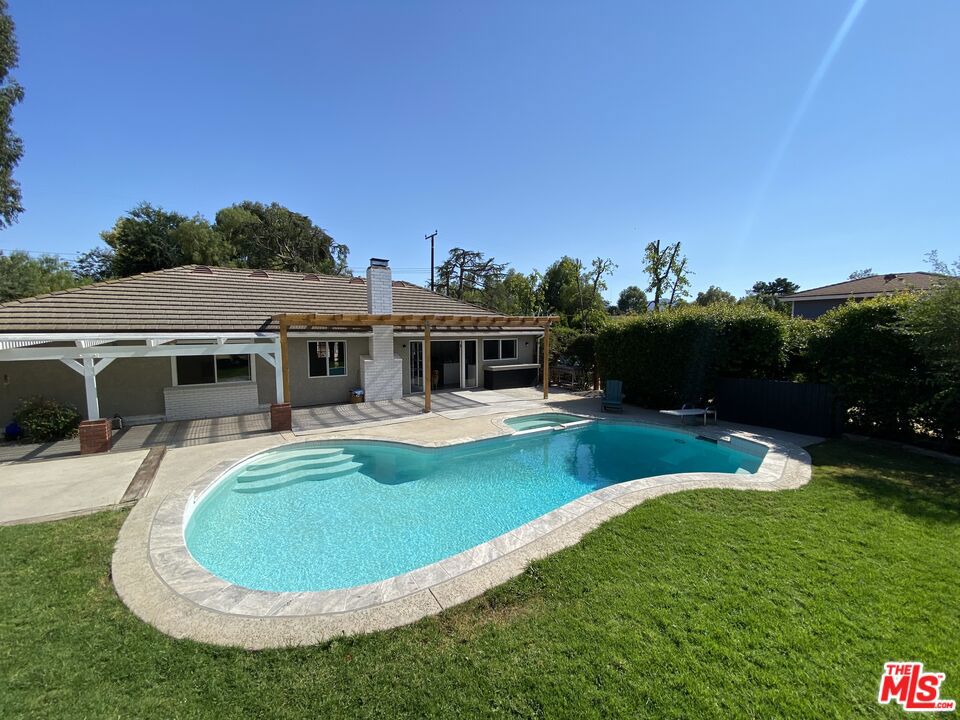 Escape to your very own private oasis. This beautifully upgraded Ranch Style property offers the perfect blend of luxury, comfort, and rural charm. Ideal for those who dream of space and a connection to nature whether you're an equestrian enthusiast, hobby farmer, artist, or simply seeking a peaceful retreat. Step inside to find a stunning remodeled kitchen and a spacious living room with exposed beams with a cozy gas fireplace in the living/dining area. A generous covered patio with a built-in concrete countertop and BBQ area sets the stage for effortless indoor-outdoor living. Enjoy your sparkling private pool and spa, along with a large metal-roof barn featuring two updated stalls, and a large flexible space perfect for a game room, hobby area, or more. The property also boasts a horse paddock, a large arena, and a 4-car garage with large area in front. Additional highlights include an adorable "ME-shed" with a deck, a garden with water supply, a fruit tree lane, and more. All of this is set along a quiet dirt road, offering privacy, serenity, and room to live the lifestyle you've dreamed of. Close to trendy shops and restaurants. NEW A/C unit and Pool heater.