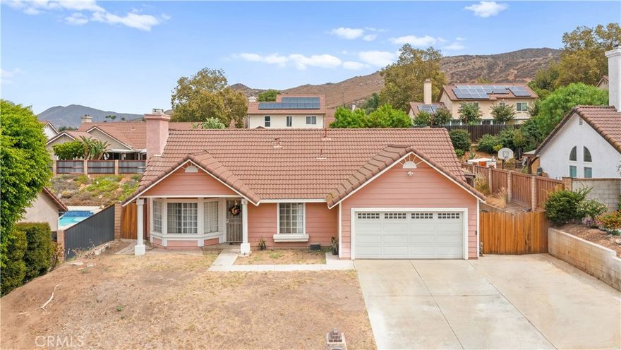 Welcome to this inviting 3-bedroom, 2-bathroom single-story home in Jurupa Valley, offering 1,125 square feet of thoughtfully designed living space on a generous 8,712 square foot lot. Perfectly blending modern upgrades with practical features, this home is ideal for families, first-time buyers, or anyone seeking comfort and convenience.

Remodeled Kitchen: Featuring updated cabinetry, sleek countertops, and stainless steel appliances including double oven gas cooktop, perfect for cooking and hosting.

Primary Suite: A private retreat with an en-suite bathroom for added comfort and relaxation.

Central Air & Heat: Stay comfortable in any season with efficient central air conditioning and heating.

Two-Car Garage: Ample space for parking and storage, complete with a separate laundry room for added functionality.

RV Parking: Ideal for outdoor enthusiasts, with dedicated space for an RV or large vehicles.

Tile Roof: Low-maintenance and durable, enhancing the home’s longevity and curb appeal.

Cozy Fireplace: The living room’s fireplace creates a warm and welcoming ambiance for gatherings.

Expansive Lot: The 8,712 square foot lot offers plenty of room for outdoor activities, gardening, or potential expansion.

Located within the Jurupa Unified School District, providing access to quality schools for growing families.

Situated in a peaceful Jurupa Valley neighborhood with easy access to local parks, shopping, dining, and major freeways for commuting.

This beautifully updated home combines style, functionality, and a spacious lot, making it a rare find in Jurupa Valley. Don’t miss your chance to own this gem—schedule a tour today!