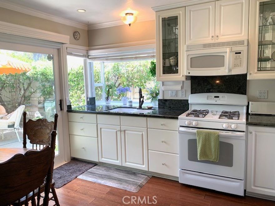 WELCOME TO WOODGATE IN YORBA LINDA! Enjoy a gorgeous single story detached home with 3 bedrooms, 2 bathrooms and an attached 2 car garage with direct access. As you enter the living room you are greeted by vaulted ceilings, beautiful hardwood floors and a fireplace to cozy up to on those chilly evenings. The updated kitchen has sleek white cabinets, granite countertops, a pantry, extra storage, a garden window and sliding glass door which provide an abundance of light. The kitchen is open to the family room and allows the conversations to flow. Located at the rear of the home is your primary bedroom with a walk in closet, sliding door leading out to the patio, beautifully updated on suite with walk in shower, white vanity with granite countertop, custom paint and wainscoting. The front bedroom has striking paint, window blinds, mirrored closet doors and a ceiling fan. There is a rear secondary bedroom for family, guests, office, etc. The updated second bath is conveniently located between the secondary bedrooms. Don't forget the back patio with lush low maintenance landscaping for privacy. Located on a serene private cul de sac. The amenities include a clubhouse, swimming pool and separate kiddie pool, nearby tennis, racquetball, basketball and a large grassy field. Centrally located to restaurants, shopping, freeways, hiking, biking, parks and the Highly Acclaimed Placentia-Linda School District. NO Smoking or Vaping allowed in the house and or in the garage. Photos taken prior to current tenants moving in. Renter's Insurance is required. Apply through RentSpree: https://apply.link/nBzfEOI