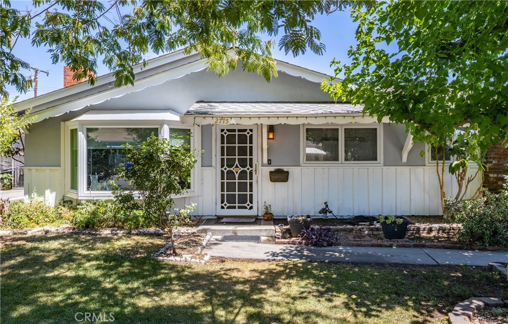 Honey Stop The Car and start packing!! Welcome to 2775 Lawrence Avenue in the North End of San Bernardino on a beautiful tree lined street. Home features 1300 square feet of living space with 3 bedrooms and 2 bathrooms. Home has been tastefully updated throughout the years showing great pride of ownership. As you walk in you will be impressed with the Dining Room to your right that is open to the remodeled Kitchen with Granite Countertops, Custom Cabinets and a Large Center Island. To the left of the Dining area you will see a large spacious Living Room with a brick fireplace and a custom Bay Window with a Seating Bench. As we continue down the hall there are plenty of shelves and a broom closet for all your supplies. Lets continue to the 3 large bedrooms including a primary suite that has an upgraded Bathroom. Primary Bedroom has a custom slider to the backyard. The additional two bedrooms are perfect with large closets. Hallway Bathroom is completely renovated with custom tilework, cabinets and countertop. Lets go the the backyard where you will fall in love!! The Back Patio Covering was custom built with lights and ceiling fans. There is also a private covered patio on the southside of the home perfect for entertaining. The Backyard is private with fruit trees, grass area and two storage sheds. There is a detached two car garage at the rear of the home. Owners will include a covered car awning as well as the Refrigerator, washer and dryer. Home features Solar Panels at an affordable monthly amount of $158.00 per month to help reduce those electric bills. Other features are the Central Air and Heat and an upgraded Water Heater. Nice neighborhood which is close to all services including schools, shopping, hospital and a few minutes to the 210 Freeway. Lets schedule an appointment to view this home and I hope to see you in Escrow!!!! : )