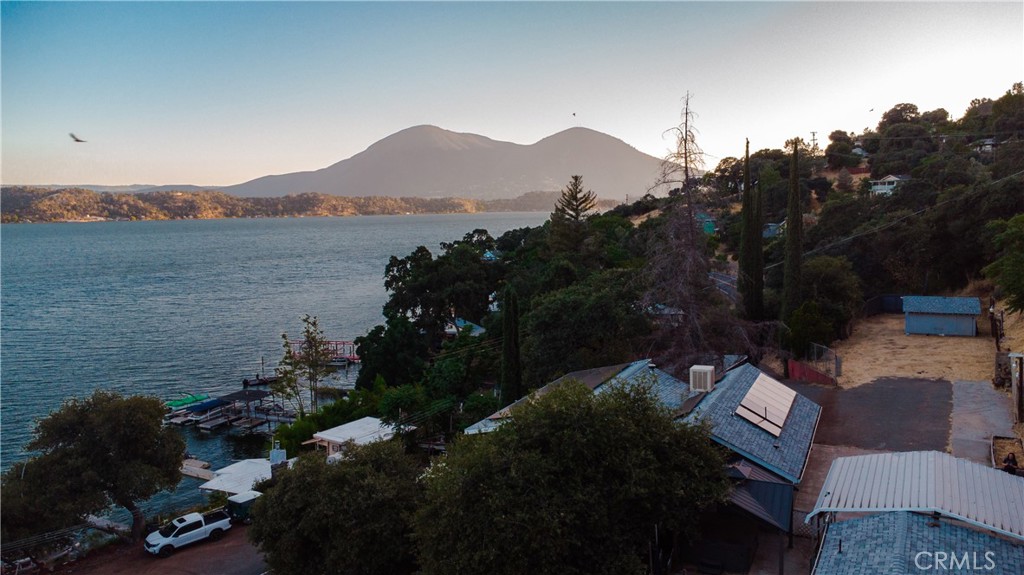 Spectacular Lake Views & Outdoor Living!
Welcome to your private retreat! This charming 2 bedroom, 2 bath home sits on an oversized 16,000+ sq ft lot and boasts panoramic lake views you have to see to believe. The updated kitchen features granite countertops and an open layout perfect for entertaining. Step outside onto the expansive deck—ideal for morning coffee or sunset dinners—and soak in the spa tucked under a romantic gazebo. There’s plenty of room for your hobbies or toys with two storage sheds and a 1-car garage with a custom workshop area for hobbies.
Whether you're searching for a peaceful home away from city life or a potential short-term rental investment, this property checks all the boxes. With space, views, and unbeatable charm, this one is ready to impress!