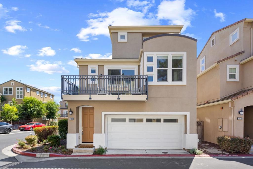 Welcome to this newer home built in 2009 by Taylor Morrison, 3-bedroom, 3.5-bathroom, spanning 1,839 sqft interior, located in one of the fastest growing city in silicon valley, Santa Clara. This residence offers a well-appointed kitchen with granite countertops, an island with sink paired with water softener, and modern appliances including a dishwasher, Kitchen hood, built-in oven range with gas, stainless steel fridge. The home features a thoughtful layout with a ground floor bedroom and full bathroom, complete with double sinks, shower, and tub. The interior boasts a mix of laminate, tile, and carpet flooring, providing a comfortable and stylish environment. Enjoy the warmth of the central forced air heating and central AC for those warmer days. The living space is enhanced by high ceilings and a cozy fireplace, perfect for gatherings or relaxing evenings. in-unit laundry on the ground floor and as well as a 2-car attached garage with tesla EV charging ready. The home is part of the Santa Clara Unified School District and enjoy ultra low Santa Clara utilities. This home perfectly blends function and style in a commuters dream location. Come visit us!