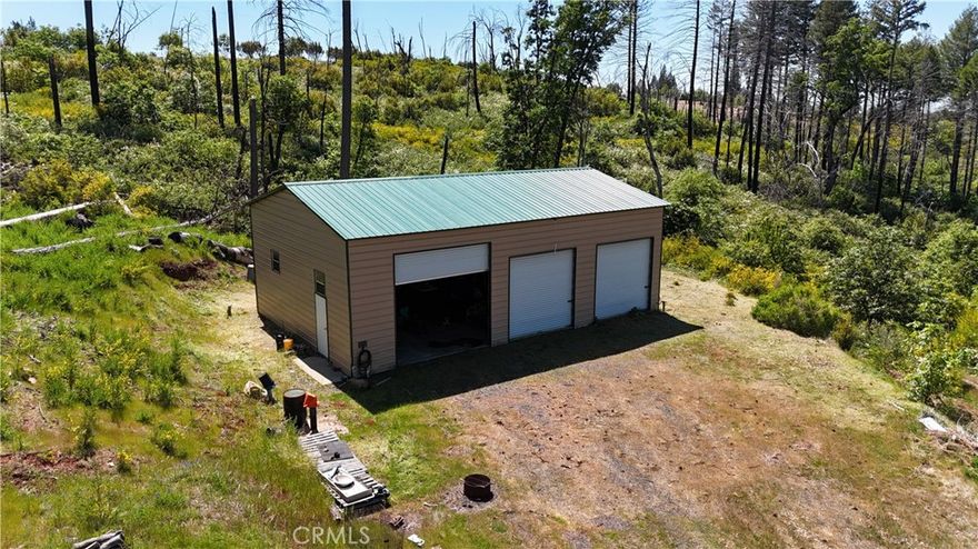 WOW - Over 10 acres of prime property with easy access just off Big Bend Rd and Hwy 70.  So many improvements on this property, hard to list, but lets give it a go! The shop is amazing, built in loft, and lots of shelving, electrical and lights.  There is another shop with no concrete floor that was damaged by a tree falling, but appears very repairable. You will find another concrete-block building with a loft, great for extra storage. With that said, you also have a commercial diesel generator equipped with substantial diesel fuel tank for extra running time, if need.  The well produces great water and includes a large holding tank that is placed on the upside of the property so it can be gravity fed.  Please note that the adjoining property is also listed for sale by a separate owner. With great views and multiple building sites, this property is ready to for you to build your dream home. Call your agent today for a private showing.