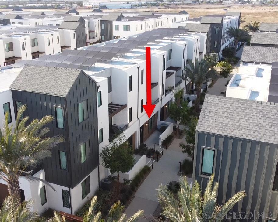 Welcome to modern living in one of South San Diego’s newest master-planned communities. Built in 2022, this stylish 2BR townhome with optional 3rd bedroom + bonus flex space offers 1,501 sq ft of thoughtfully designed comfort. The open-concept kitchen is a showstopper, featuring quartz counters, an island, upgraded shaker cabinets, and high-end stainless steel appliances including a smart refrigerator, built-in microwave, and dishwasher. Enjoy plush carpet in bedrooms, tile in the kitchen, and luxury touches throughout. The primary suite includes a walk-in closet and dual-sink bath with upgraded cabinetry. Additional highlights: oversized 2-car garage, balcony, paid Enphase solar, Rianni instant hot water system, and optional Puronix water filtration. The bonus room and optional bedroom provide flexibility for work, play, or guests. Community amenities are expanding rapidly—parks, greenbelts, sports courts, and a future private club with pool, spa, fitness center, and clubhouse. Enjoy neighborhood food truck nights, outdoor movie events, and a walkable, connected atmosphere inspired by Mexico’s Valle de Guadalupe. VA & FHA approved, this is not just a home but a lifestyle—minutes to freeways, shopping, dining, and beaches. Come see why this vibrant new community is one of San Diego’s most talked about places to live!