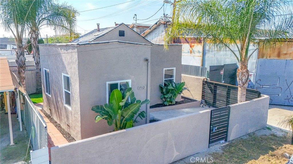Photo of 1712 E 57th St, Los Angeles, CA 90058 (MLS # DW26064382)