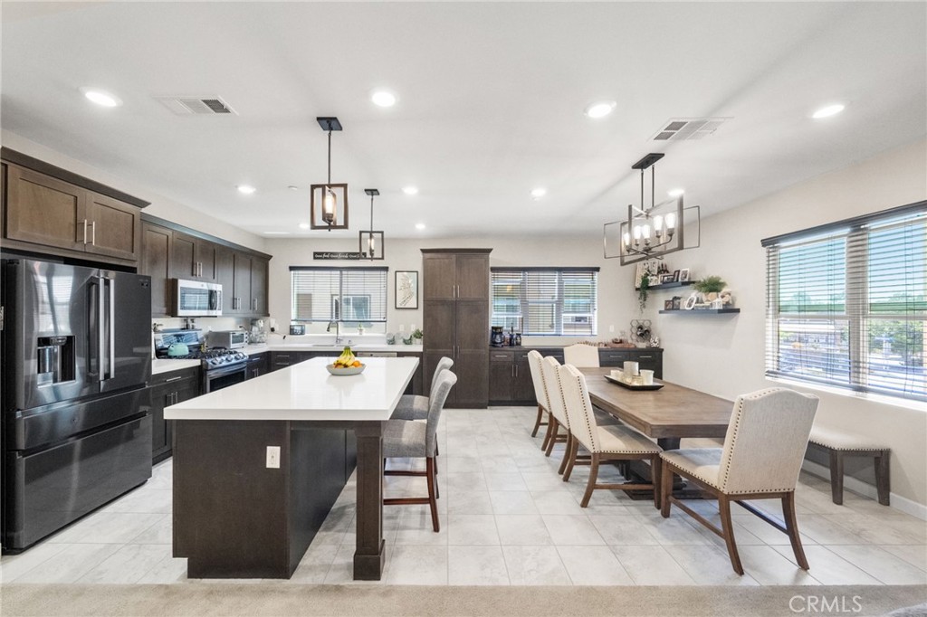 Stunning 4 bed, 3.5 bath end-unit townhome in the highly desirable Avila community of Shadowridge. Built in 2019, this nearly 2,000 sq ft tri-level home combines modern style with smart functionality. The flexible floor plan includes a ground-level en-suite bedroom with private patio—ideal for guests or a home office—plus an open-concept main living area with high ceilings, abundant natural light, and a private balcony. The upgraded kitchen boasts quartz countertops, a large center island, stainless steel appliances, and built-in cabinetry that flows into the dining area.
This smart home is loaded with tech-savvy upgrades, including built-in WiFi, Ring doorbell, smart thermostat, and energy-efficient features like solar panels, tankless water heater, water softener, ceiling fans, and central A/C. The spacious primary suite includes a walk-in closet and dual-sink quartz vanity, with laundry conveniently located on the upper level. Enjoy an attached 2-car garage, only one shared wall, and access to resort-style amenities including a pool, spa, BBQ area, and landscaped grounds.
Located in the heart of Shadowridge, just minutes to shopping, dining, schools, parks, and a short drive to the coast. This move-in ready home offers privacy, efficiency, and convenience in one of North County’s most desirable communities.