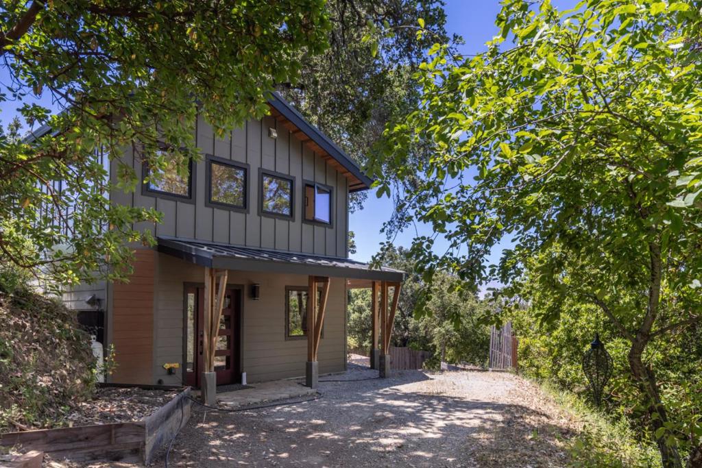 Enjoy a peaceful escape at this off-grid ocean view retreat nestled on over 10 acres in the Lower Greenridge neighborhood of Palo Colorado. This is a tenants-in-common sale of one of two homes located on the parcel. This newly constructed 1,173 sq ft home features 2 bedrooms and 2 bathrooms, thoughtfully designed to maximize comfort and views. The home offers stunning ocean vistas from the primary bedroom and an expansive deck perfect for soaking in the natural surroundings. The property is equipped to support an off-grid lifestyle. Come experience the beauty, serenity, and possibility of life on the coast. See ML82005549 to view the second listing included in the TIC. Do not disturb the occupants of the property - APPOINTMENT REQUIRED. The seller has a Tenants in Common (TIC) agreement drafted by SirkinLaw APC, which outlines the relationship between the two ownership shares and defines common areas and responsibilities.