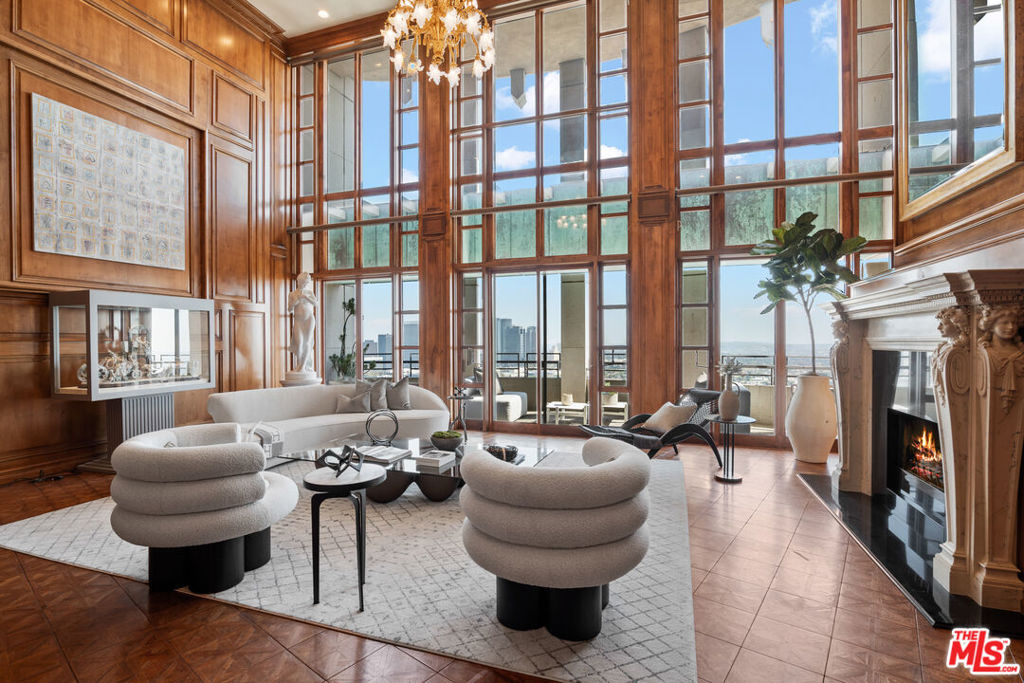 New Price --The ultimate Penthouse on fashionable Wilshire Corridor now boasts the supreme value among all penthouses citywide ! This exquisite and unrivaled 2-story residence at The Wilshire attracts thrilling natural light and breathtaking, one-of-a-kind panoramic views from Downtown LA to Santa Monica Bay, the Ocean, and Catalina Island beyond. Soaring high ceilings in the main Living Room breathe drama into the overall design and make the solid statement of a preeminent residence in the sky. A grand curving staircase reaches upward from the Living Rm to the upper floor bedroom suite destinations. Warm finishes are achieved with lavish expanse of wood-carved or paneled walls in the main entertainment spaces. Providing 5,732 S/F, this 4 bedroom 6 bath penthouse offers a Media Room, gourmet Kitchen with spacious jaw-dropping outdoor terrace, beautiful Primary Suite w/ Sitting Room, white marble bath and multiple walk-in closets. The Wilshire offers a secure controlled-access Elevator opening directly into the Private Foyer. Balconies offer "jetliner" wrap-around views of Century City, Hollywood Hills & Griffith Observatory and are all on the preferred side of this bldg---facing south, away from the Wilshire Blvd orientation. Security, Valet parking, doorman, and front-desk for guest/visitor registration; day-time on-site building manager, well-appointed Banquet/Meeting Rooms, Fitness Center, Pool, and Extra Storage, including separate 36-bottle Wine Lockers. Just blocks from the ever-green Comstock Park, Hammer Museum, Geffen Playhouse, UCLA medical center, LA Country Club, dining & shopping. East coast sophistication meets a modernized west coast luxury lifestyle. There have been less than 26 sales at or above the 22nd Floor in the 30-year history of this Wilshire Corridor masterpiece bldg. No furniture or art is included in the purchase price (neither staged nor owned by seller). Incomparable !