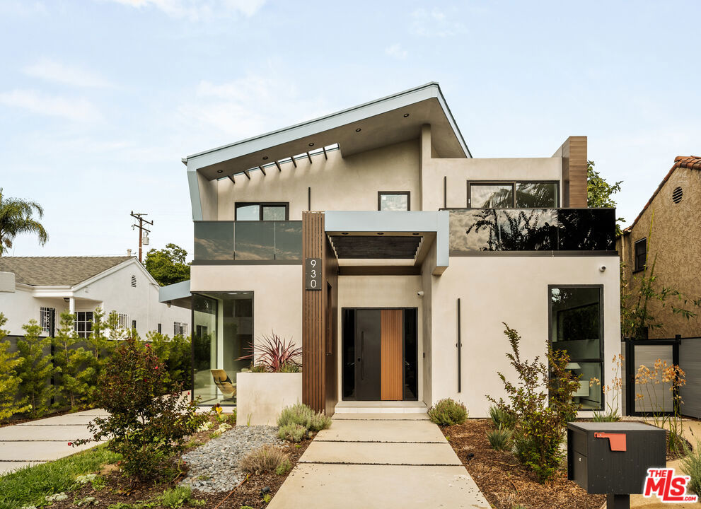 A masterful blend of architectural innovation and modern luxury by acclaimed designer Amit Apel, 930 N La Jolla Avenue is the crown jewel of La Jolla Avenue. Located in the heart of West Hollywood, this newly constructed modern showpiece is more than just a residence; it's a bold statement in design, lifestyle, and sophistication.An incredible opportunity for the discerning buyer - no ULA tax applies, and the owner is open to accepting cryptocurrency. Additionally, the seller is willing to install a gated entry offering enhanced privacy and exclusivity.Step inside and be captivated by a dramatic open floor plan anchored by a striking black glass floor feature that offers a window into the expansive lower level. The formal dining area impresses with a show-stopping chandelier, sleek fireplace, and floor-to-ceiling glass wall that floods the space with natural light. The living area flows effortlessly into a gourmet kitchen outfitted with German cabinetry, an oversized waterfall eat-in island, top-of-the-line Miele appliances, and sculptural Dekton countertops. Disappearing glass walls open to an entertainer's dream backyard: a smart pool and spa with micro-LED lighting and built-in cover, a sunken fire pit lounge, and expansive outdoor space for al fresco living.Upstairs, the luxurious primary suite offers a true retreat with 14-foot vaulted ceilings, a private balcony, spa-style bath with soaking tub and glass shower, dual floating vanities, and two large walk-in closets. Each guest bedroom includes an en suite bath, with two featuring private balconies and serene views of the Hollywood Hills. A rare 2,000 sqft basement delivers exceptional versatility complete with a soundproof home theater (or future music studio), gym, bonus rooms, guest accommodations, and a wellness area featuring a Clear Canadian cedar sauna with Himalayan salt insert and IPE flooring.Built with premium materials and state-of-the-art technology including Fleetwood doors and windows, a Zoeller pump system, triple-zone HVAC, central audio, and Wi-Fi extenders - this one-of-a-kind home pairs luxury with long-lasting quality in one of Los Angeles' most desirable neighborhoods.