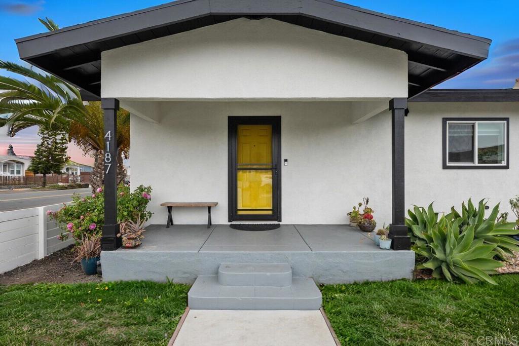 Welcome to 4187 Wilson Avenue, a 2 bedroom, 1 bathroom Craftsman bungalow that combines impeccable style, prime location, and golden opportunities for growth. This classic home is turn-key and positioned on a corner lot, and has been thoughtfully remodeled throughout, making it the most affordable updated single family home in the neighborhood! The open-concept living area is filled with natural light and features durable LVP flooring and a contemporary gas fireplace. The designer kitchen boasts marble-look quartz countertops, a farmhouse sink, subway tile backsplash, white shaker cabinets, and stainless-steel appliances. Both bedrooms connect through a fully renovated Jack & Jill bathroom, with other upgrades including an updated roof, plumbing, gaslines, tankless water heater, enclosed fencing, stucco, walkways, and electrical. Your washer and dryer is conveniently located near the back deck. Located in a highly walkable area near local schools, parks, popular restaurants, and neighborhood entertainment, this home offers practical convenience in addition to long-term upside. The lot is zoned for potential expansion, presenting a fantastic opportunity for homeowners or investors looking to maximize value. With motivated sellers this is the deal you’ve been looking for, and your chance to own a move-in ready in metro San Diego!