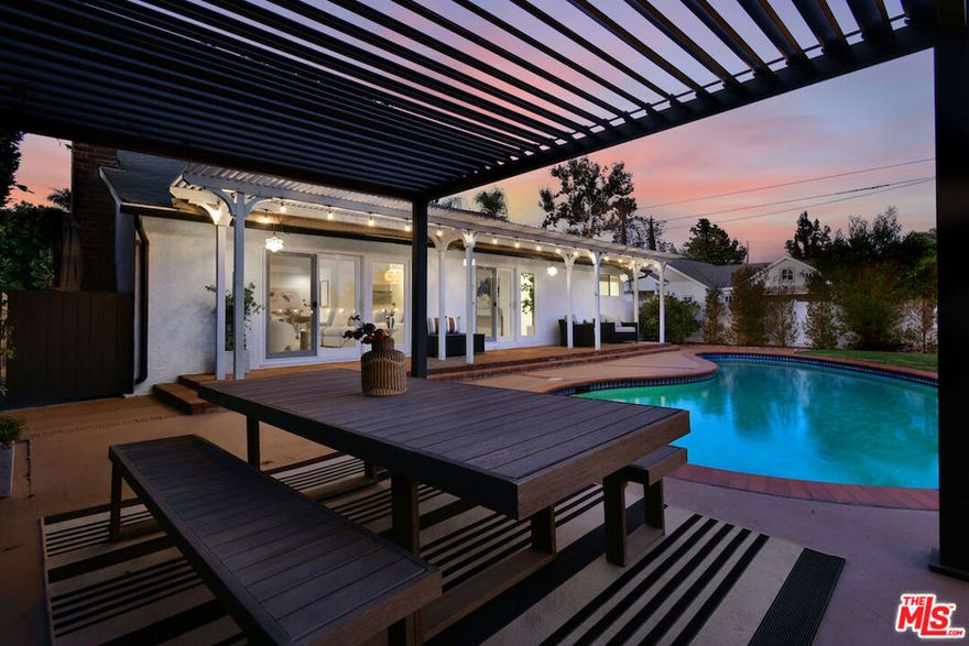 This beautiful home centrally located in prime Valley Village, is more than a just a home, it's a lifestyle upgrade from the backyard oasis, to the fully remodeled kitchen & bathrooms, whether you're hosting guests or unwinding at the end of the day, this space is pure California living. This is truly the perfect family home featuring 4 bdrms, 3 BA's and a huge family room that opens to a large grassy play area completely separate from the pool area. The entry double doors of the home open to a formal entry w/ freshly refinished flooring, recessed lighting, and an open, inviting floor plan designed for modern living and effortless entertaining. The spacious living room features high-beamed ceilings, a cozy fireplace & sliding doors that open to a private bkyd complete w/a classic kidney-shaped pool, charming cabana, brick patio & new perimeter fencing. At the heart of the home is a chef's dream kitchen fully remodeled w/top-of-the-line Viking appliances: convection & separate standard oven, warming drawer, 5 burner stove, french door refrigerator, Bosch dishwasher, quartz countertops, a farm sink & custom cabinetry. Thoughtful details like a coffee nook, mini subway tile backsplash & hidden storage solutions make this space both fabulous & functional. The Family Room is an ideal indoor/outdoor living space for a family - kids can play outside on the swing set & grassy area while the parents can relax inside & entertain. The serene primary suite features dual closets, pool access & a spa-inspired en-suite bath w/double sinks & a beautifully tiled shower. Two additional bedrooms share a stylishly updated full bath, while a 4th bedroom near the front of the house has its own remodeled bath. Additional highlights include: New top-of-the-line, energy-efficient central air and heating, Whole-home salt-free water filtration (LifeSource), New insulation throughout, Double-paned windows with custom shutters and window treatments, Updated pool pump and security system, Newer gutters and a convenient dog run.  Located within easy reach of the Westside, downtown LA,  Studio City, Burbank & Hollywood Studios, top-rated public and private schools, and vibrant shopping and dining The pride of ownership is evident in every thoughtful detail. This home is a 10+ and will not last!