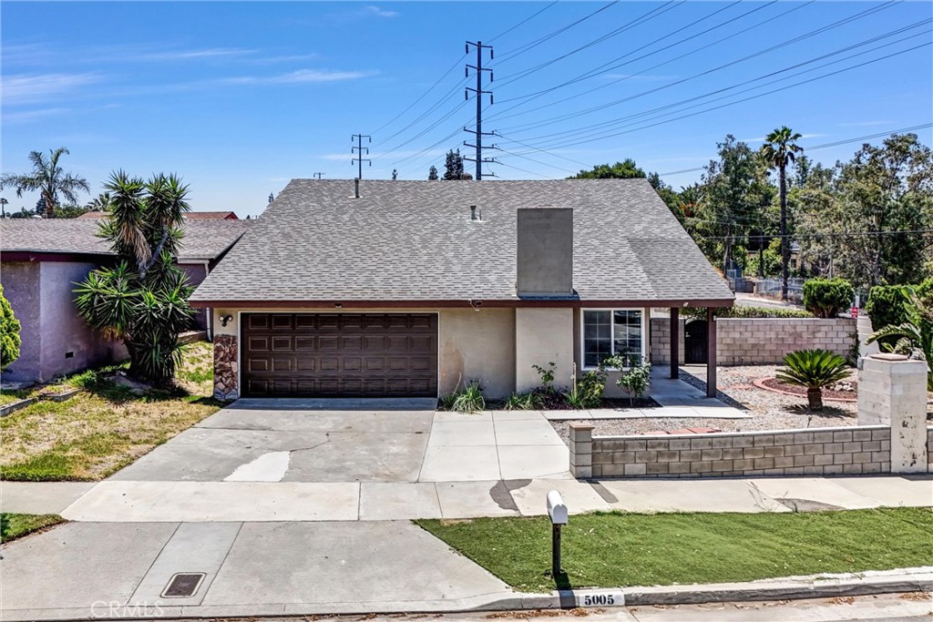 Welcome to this spacious and versatile home located on a large corner lot in a quiet neighborhood near UC Riverside! Conveniently situated within walking distance to the Crest Shopping Center, with easy access to restaurants, grocery stores, and major freeways—this location offers both comfort and convenience. The home features a desirable layout with a primary bedroom and bonus room (potential 5th bedroom) plus a full bathroom on the main floor—perfect for home office, or guest use. The primary bedroom offers direct access to the backyard through sliding glass doors. Upstairs, you’ll find three additional bedrooms and another full bathroom. Interior highlights include laminate and tile flooring throughout, new kitchen tile flooring, granite countertops, high vaulted ceilings with beautiful exposed wood beams, a cozy gas fireplace, and an open dining area with backyard access. Additional upgrades include a new garage door and a new water heater.
The large backyard is ideal for entertaining, gardening, or relaxing outdoors. A 2-car attached garage completes the package.
Whether you're looking for a primary residence or an investment opportunity, this home’s layout and location near UCR make it a great option!!