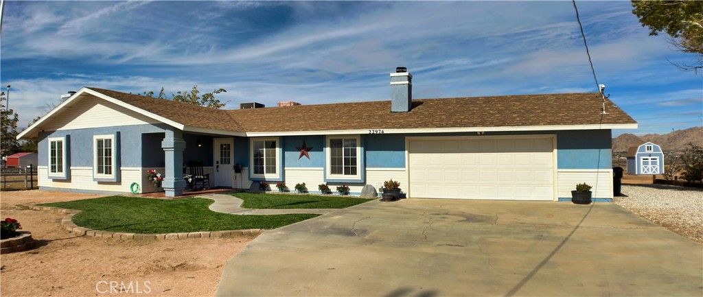 Photo of 22974 Standing Rock Rd, Apple Valley, CA 92307 (MLS # HD25266274)